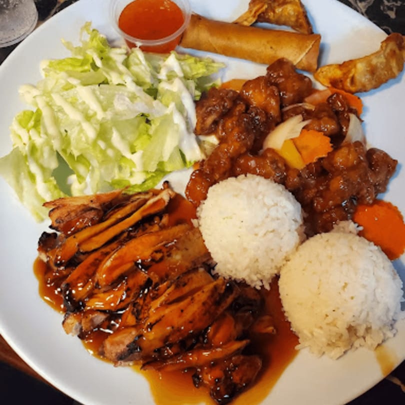 Nara Teriyaki and Pho's teriyaki chicken, sweet and sour chicken, rice, salad, egg roll, and dumplings.